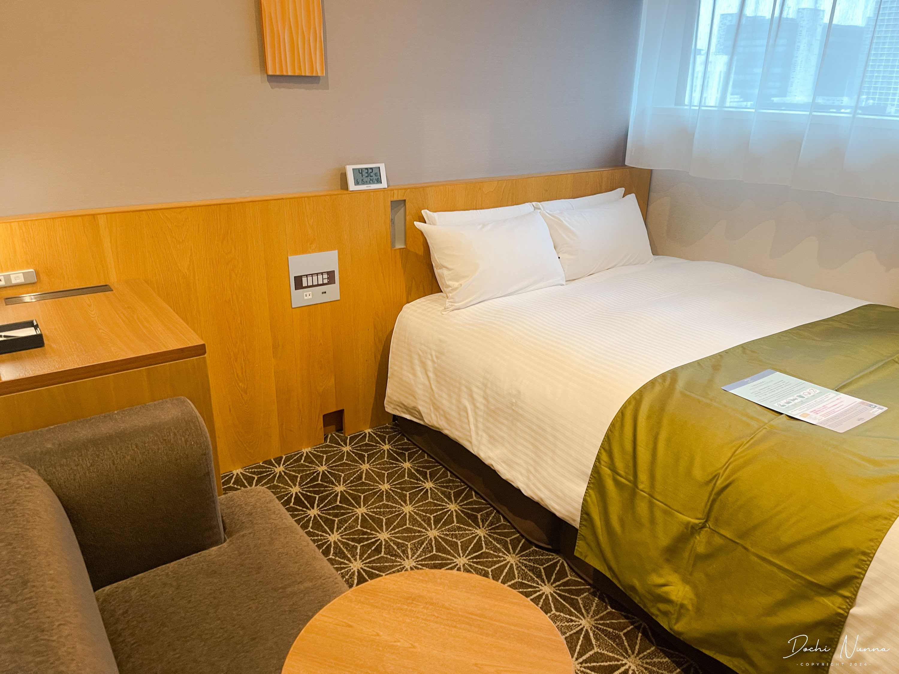 The compact bedroom at Hotel Gracery