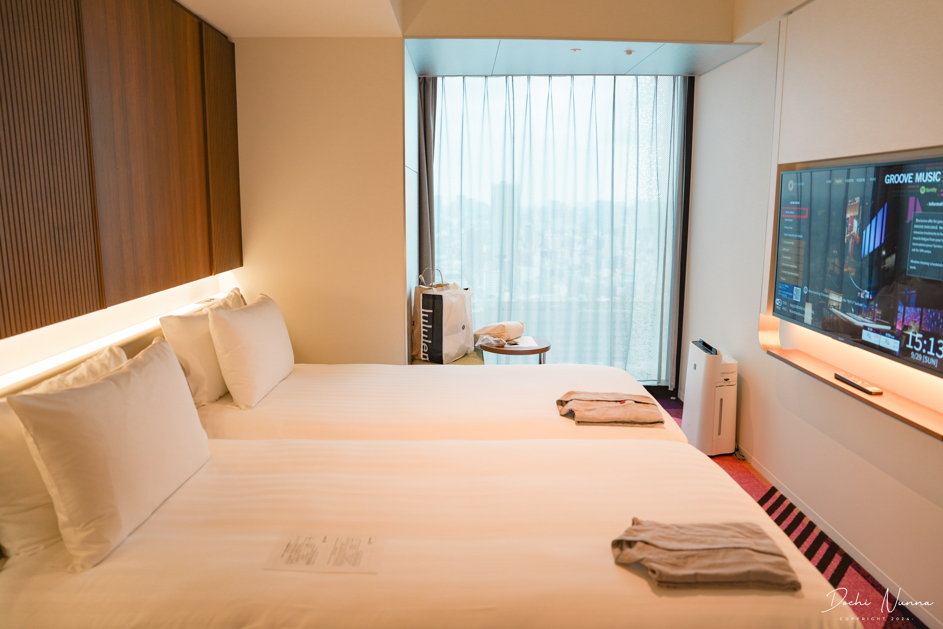 The modern exterior of the Tokyu Kabukicho Tower, home to HOTEL GROOVE