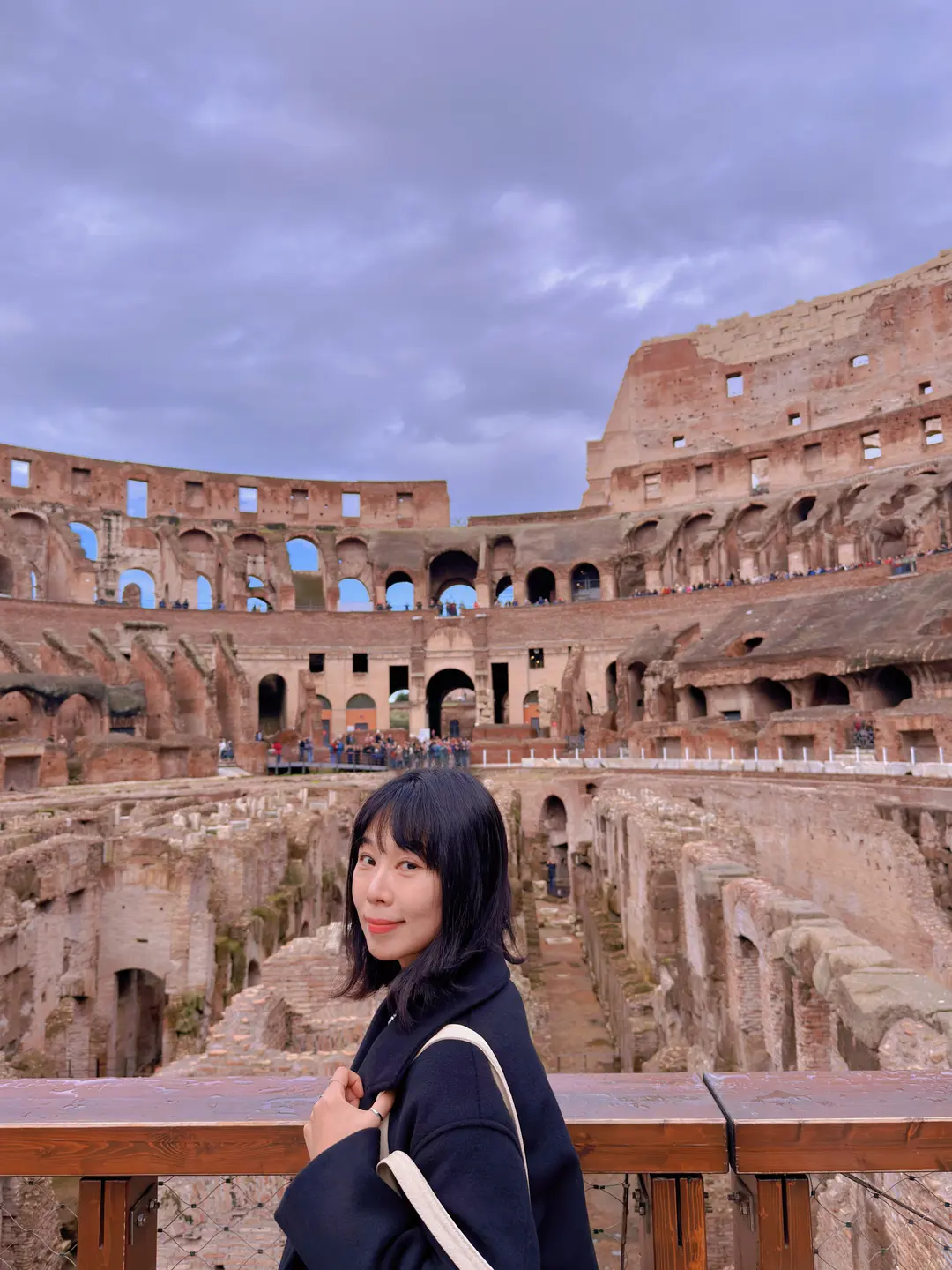 Tourist taking a photo on the arena floor