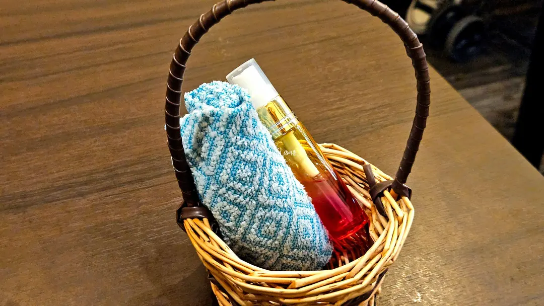 Warm hand towel in a basket