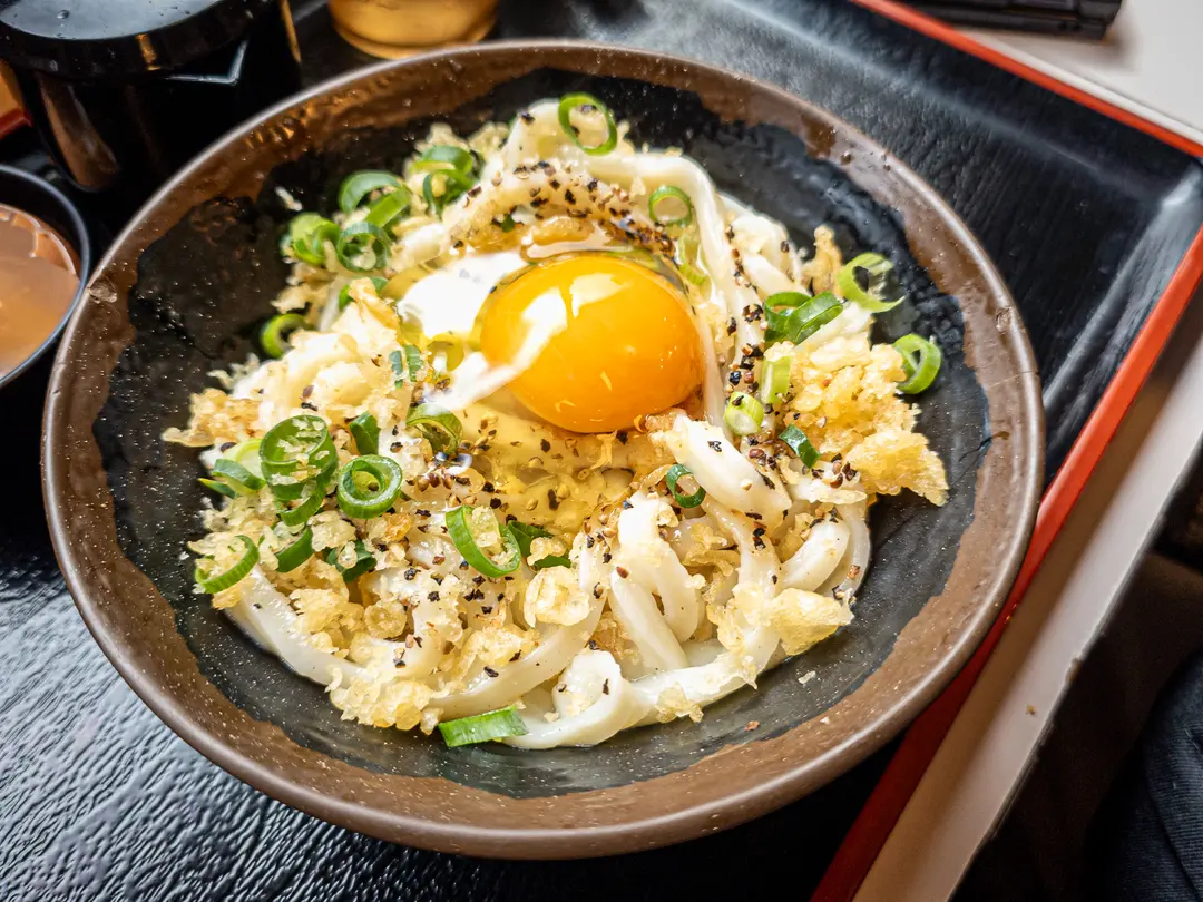 Adding raw egg to Kama Butter Udon