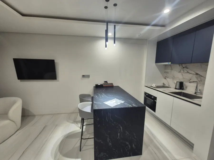 Living area with sofa chairs and table