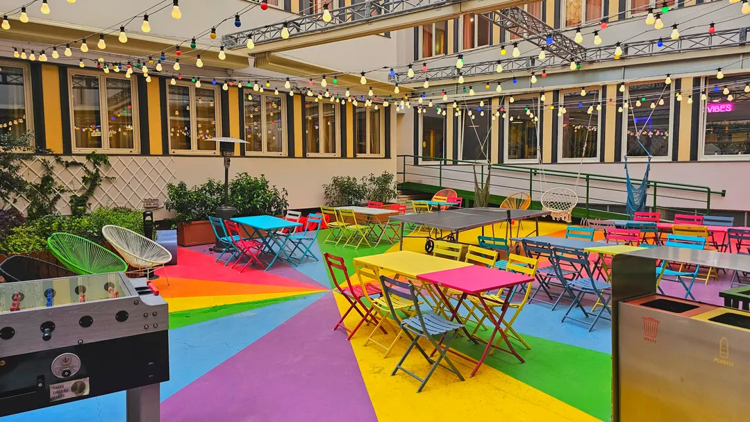 An outdoor garden-like common space. It's so colorful and photogenic!