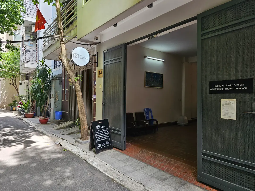 Cafe entrance exterior and alleyway sign