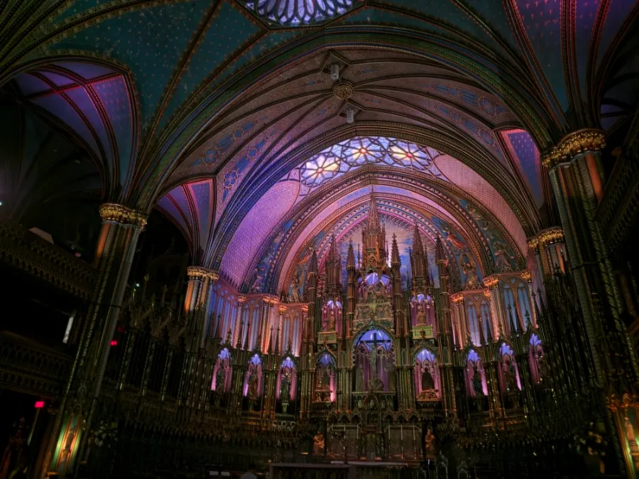 Interior of Notre Dame Montreal with purple lighting