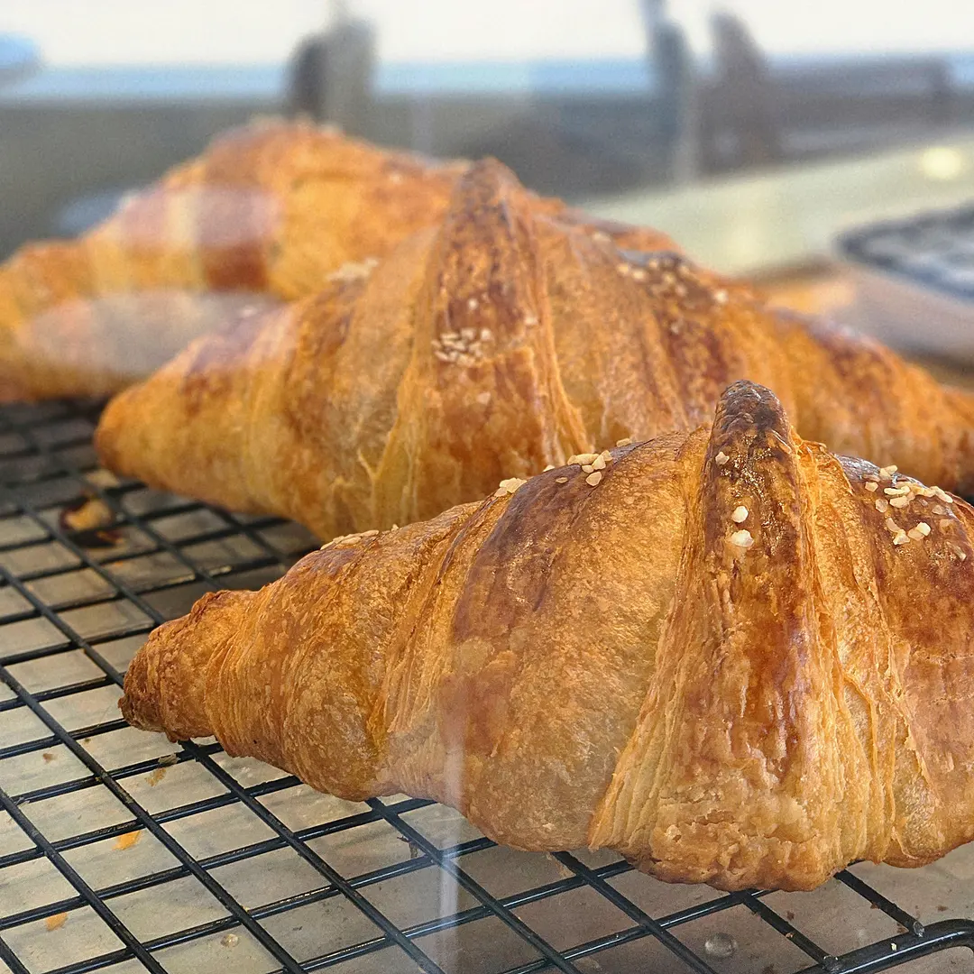Warm bakery treats near the entrance