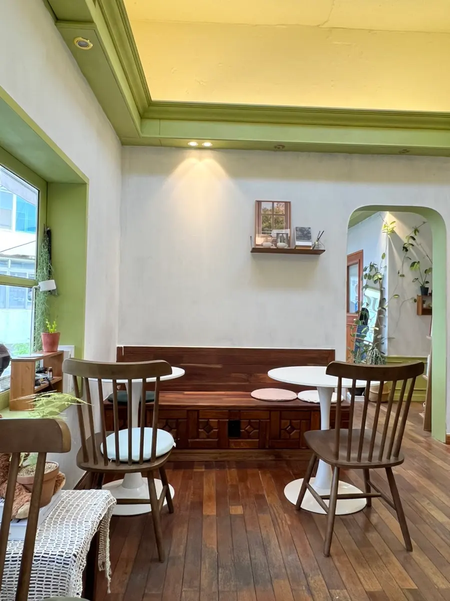 Plant-filled corner seating at Our Leaf