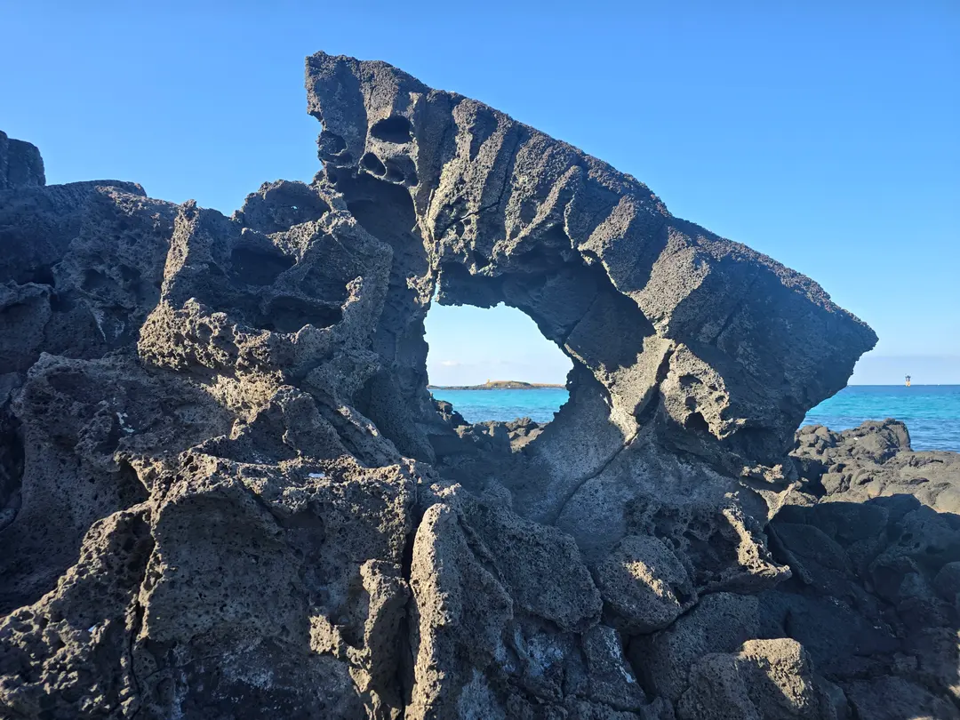 A view of Daryeodo Island framed through the stone hole