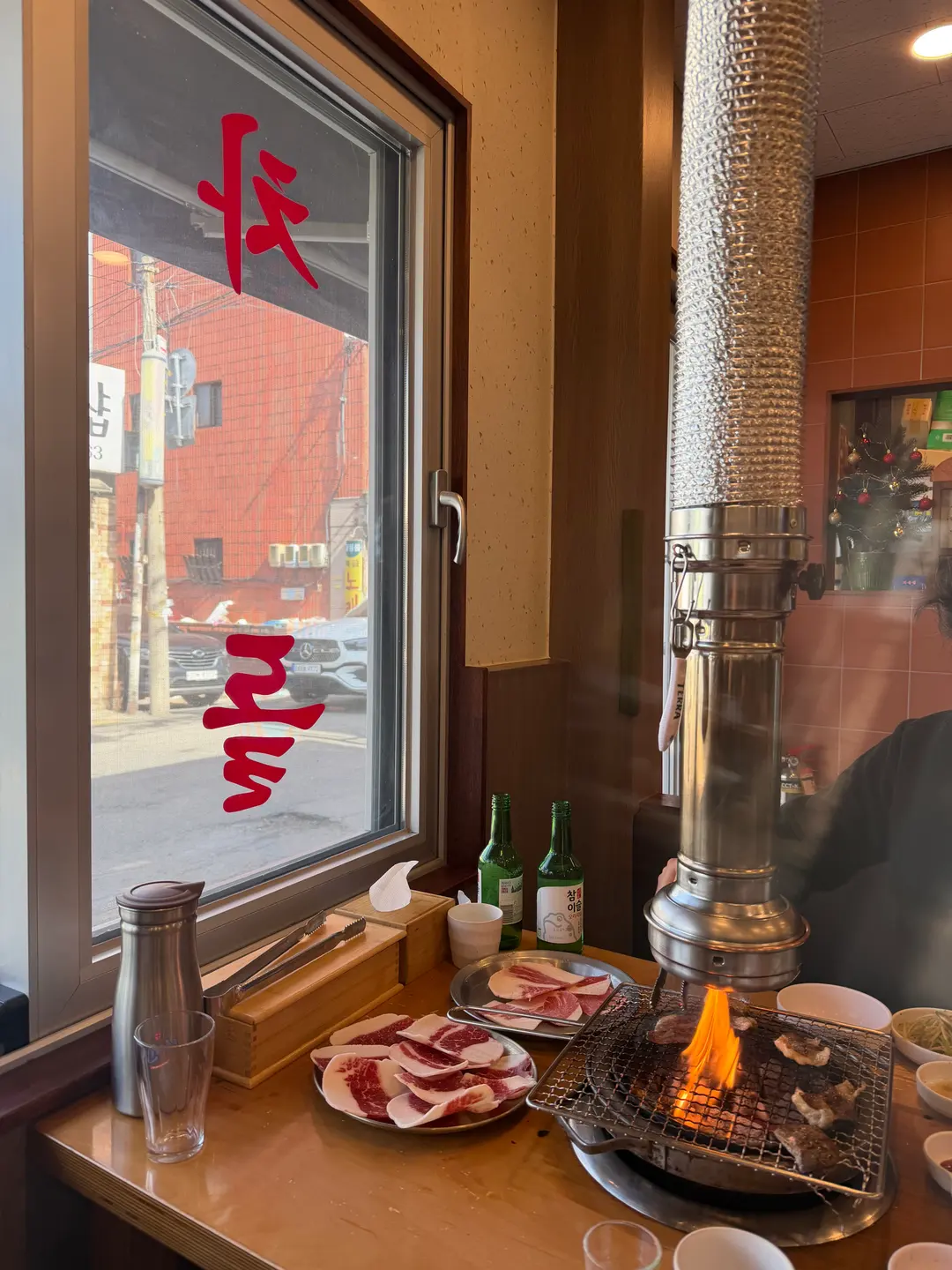 Savoring grilled brisket dipped in sesame oil