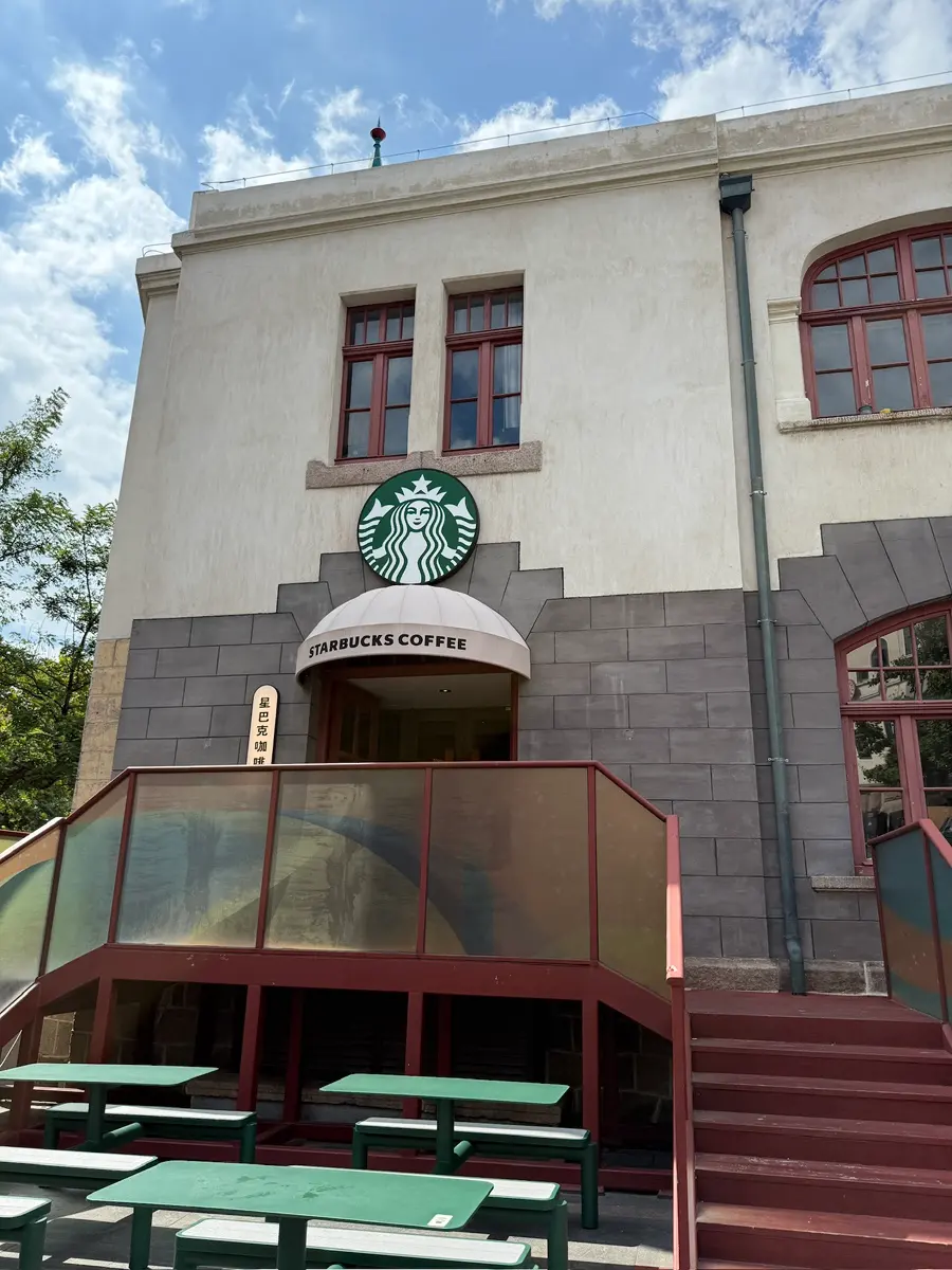 Walking with coffee in Qingdao