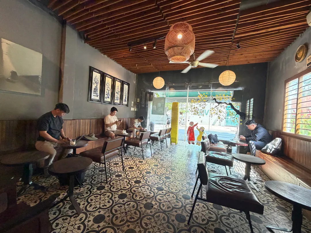 People working on laptops inside the cafe