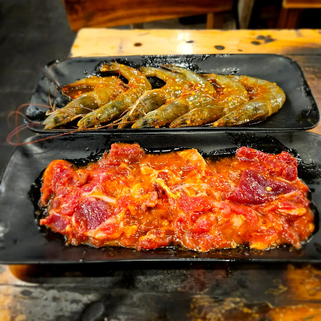 Raw meats and shrimp for grilling