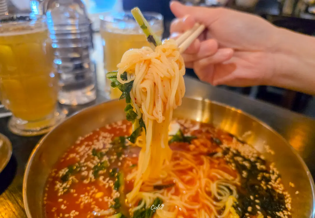 Chewy cold kimchi noodles close up