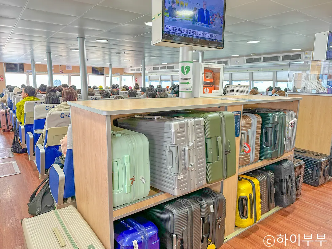 A suitcase placed in the ferry aisle