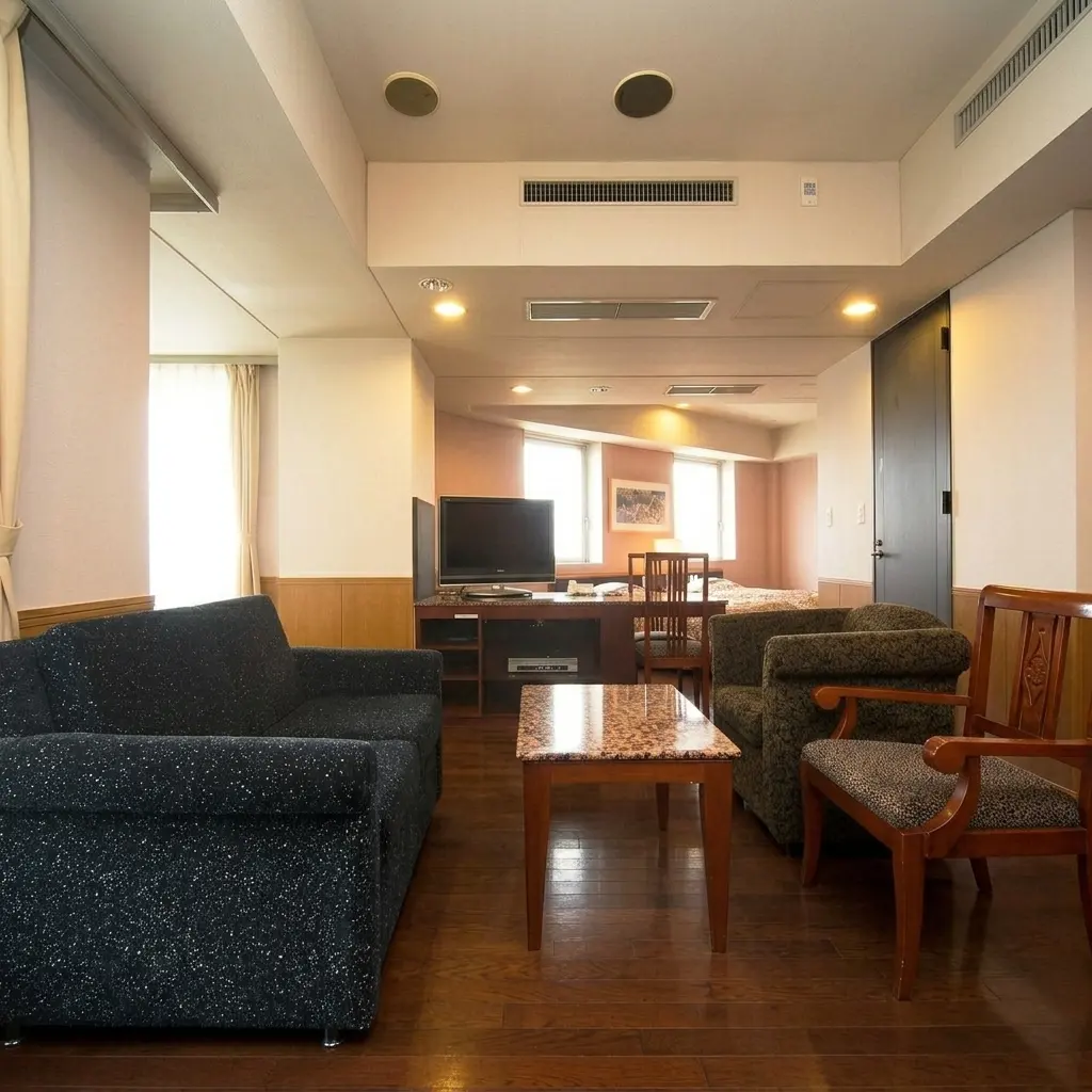 Family room with a sofa and beds