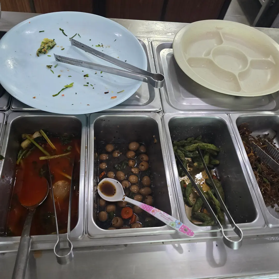 Assortment of Korean side dishes at the self-service bar