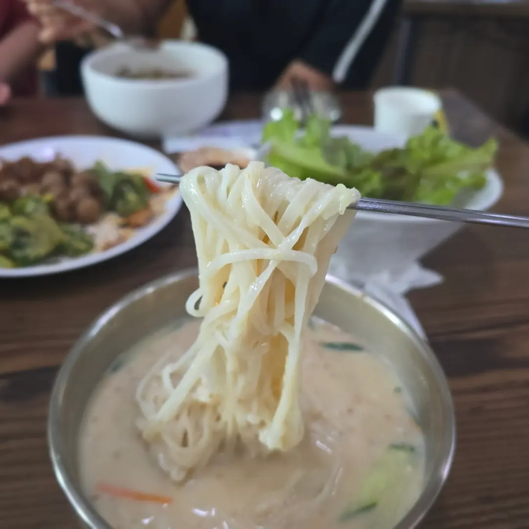 Kongguksu noodles coated in creamy soybean broth