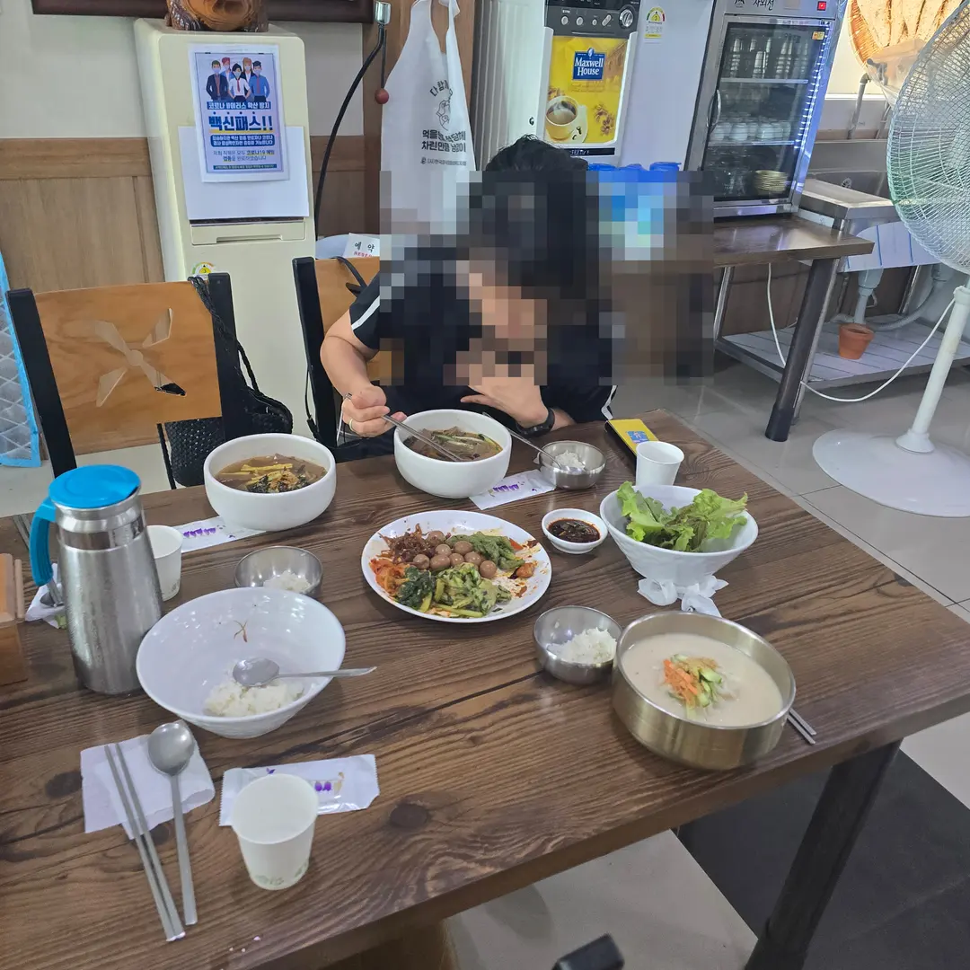 Full meal spread with various side dishes from the self-service bar