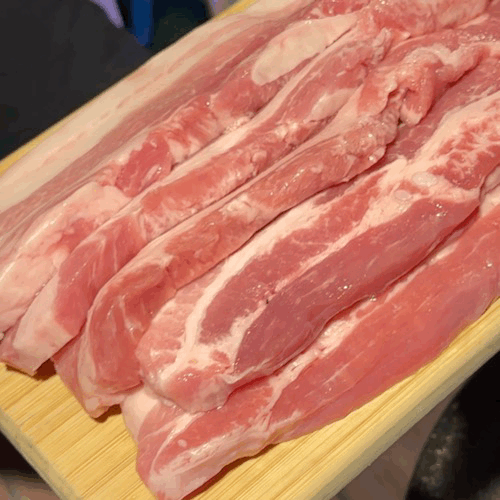 Close-up of fresh pork belly slices