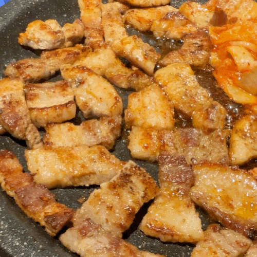 Close-up of a ssam (wrap) with pork belly