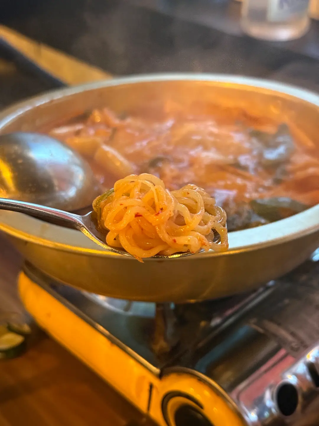 Close-up of Dalbit Tteokbokki with rice cakes, noodles, and fish cakes