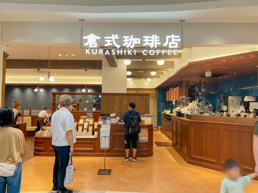 The interior of Kurashiki Coffee, showcasing its elegant and cozy ambiance with unique coffee brewing equipment.