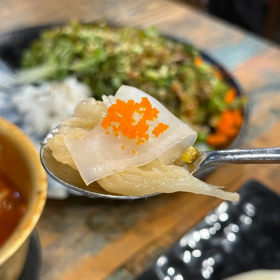 Cuttlefish sashimi wrapped in white kimchi