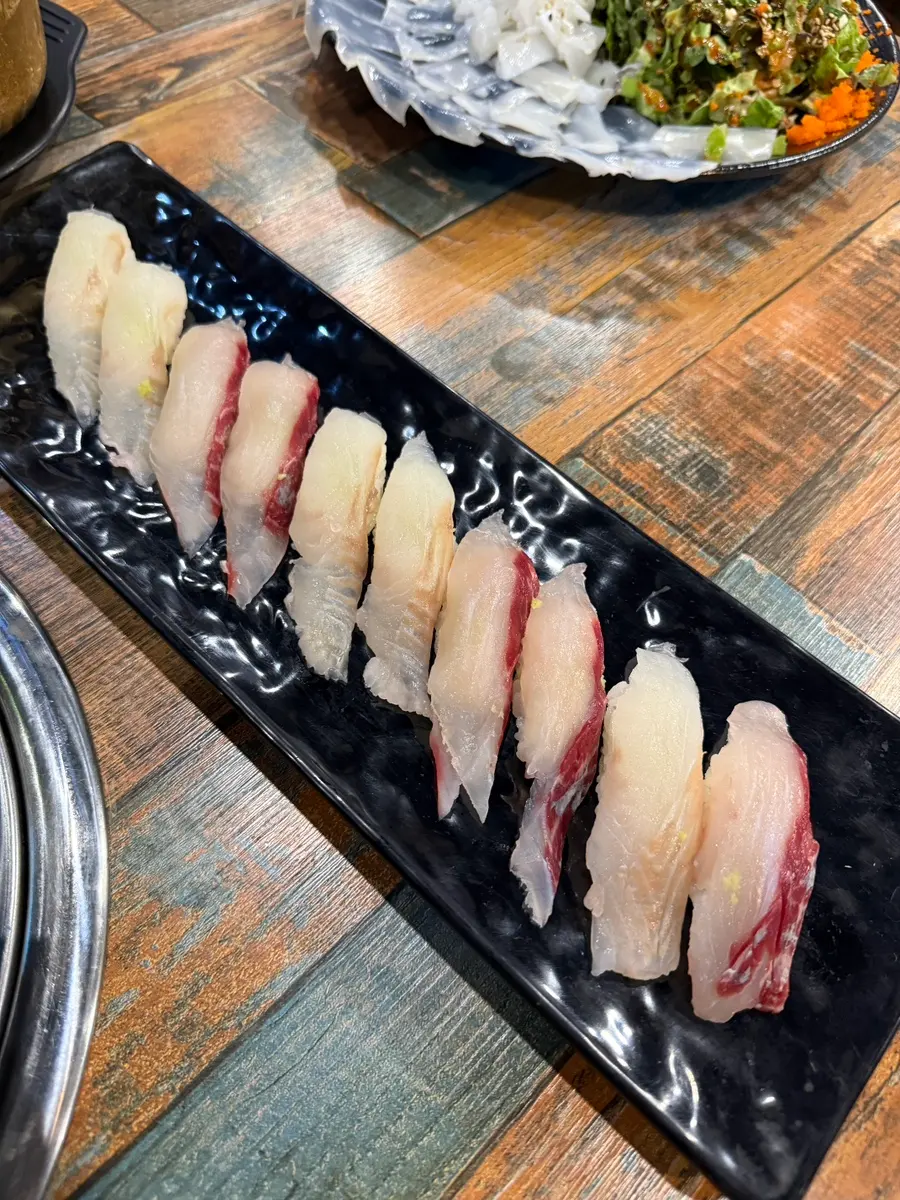 Plate of fresh fish sushi, 10 pieces
