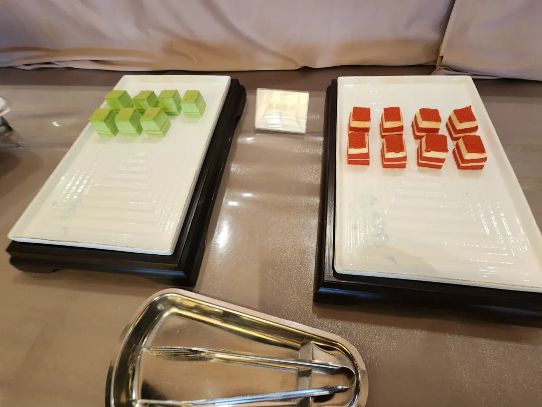 Fruits and mini cakes at breakfast