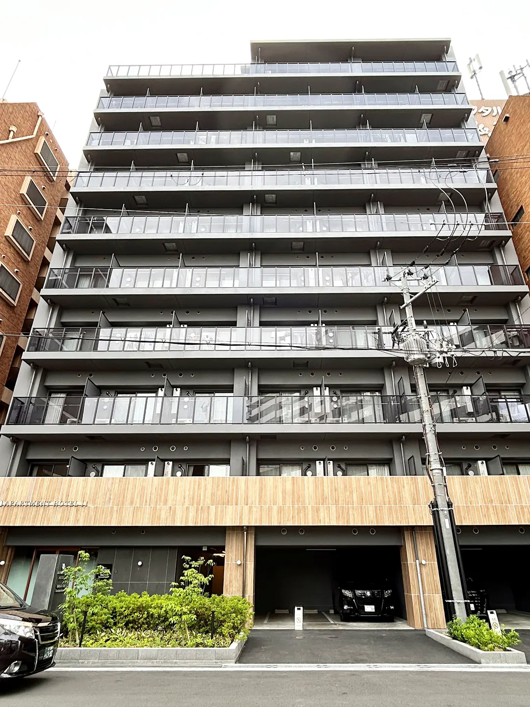 An apartment-style accommodation, unlike typical cramped Osaka hotels, offers spacious rooms and a balcony for a refreshing feel.
