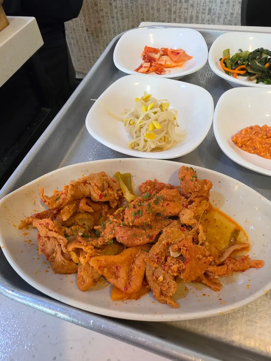 A close-up of the perfectly cooked Jeyuk-bokkeum (spicy stir-fried pork) at Tokkiwa Geobukjeon