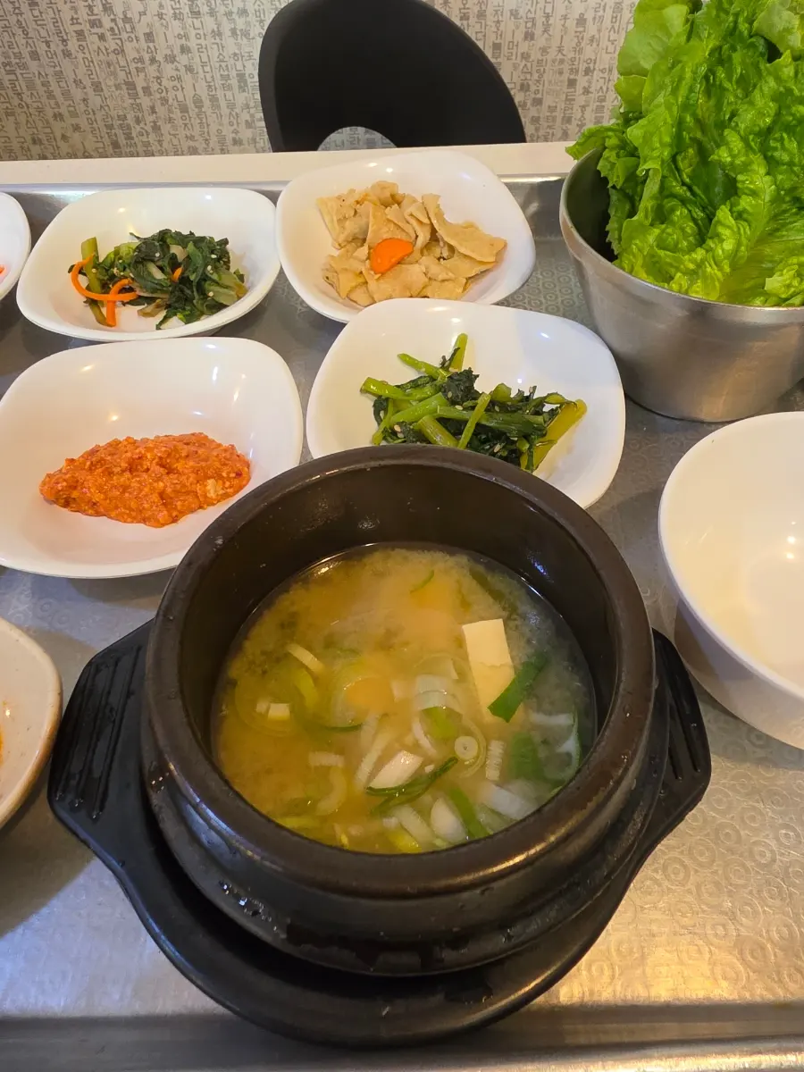 A comforting bowl of Doenjang-guk (soybean paste stew) with tofu, served as the daily soup
