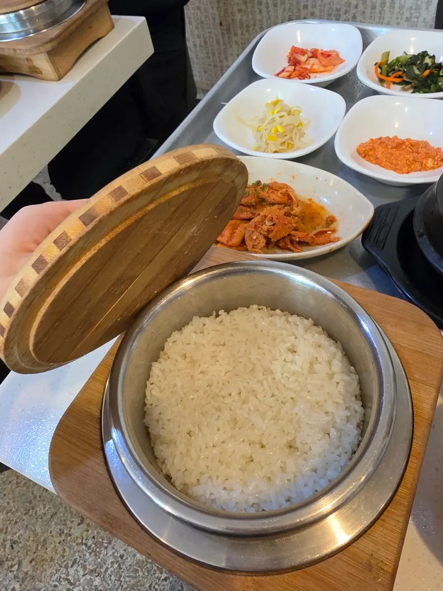 The empty stone pot with a bowl of hot water, ready to make nurungji (scorched rice)