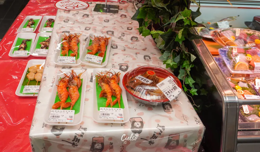 Crab legs and scallops on display at Kuromon Market