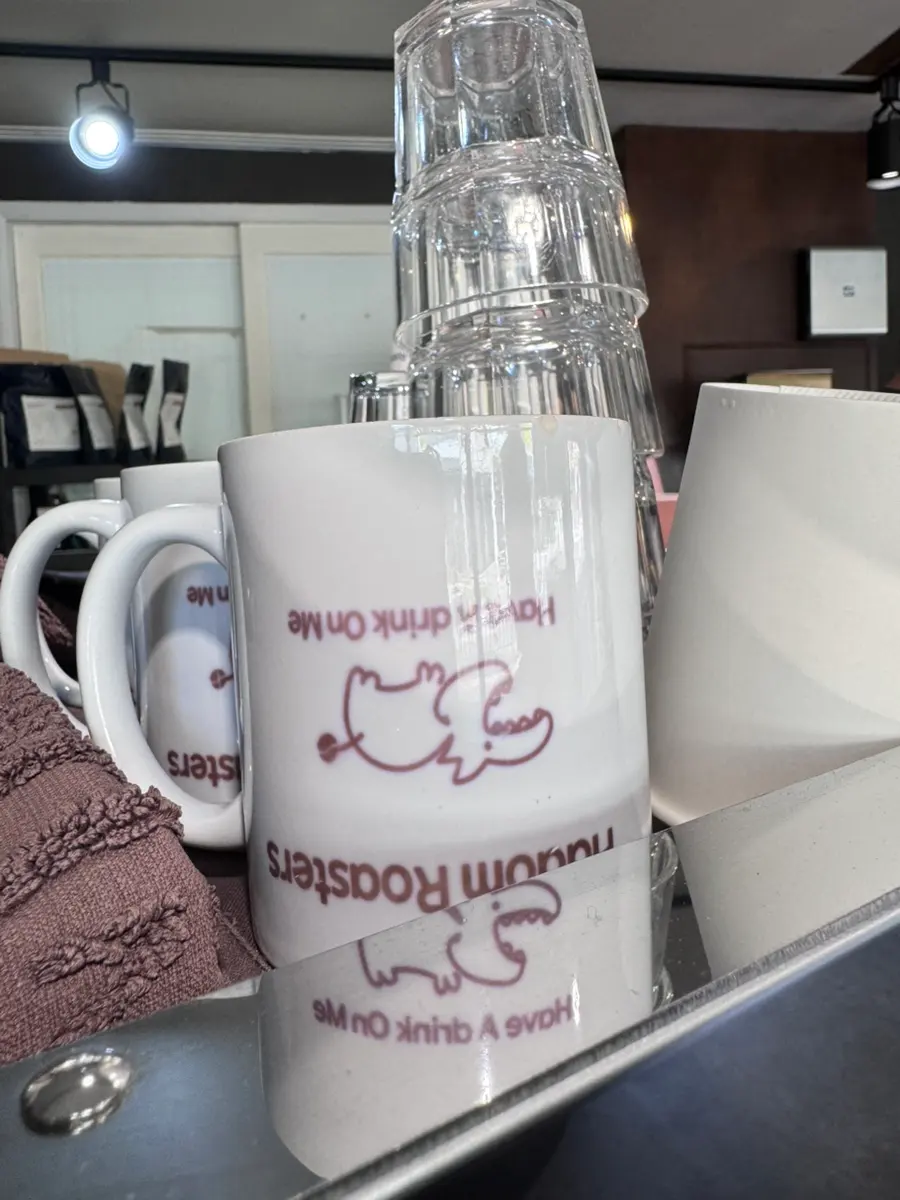 Cafe owner preparing coffee