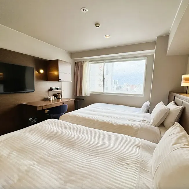 The Grand Twin Room felt spacious and comfortable for three people (Source: Trip.com).