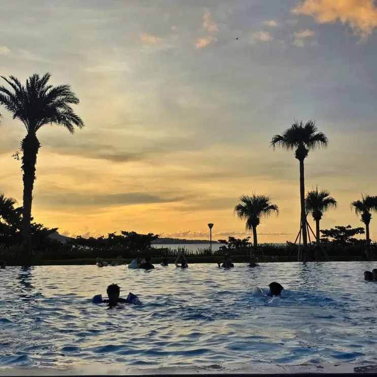 The Orion Hotel Motobu Okinawa: Ocean View, Pool, and Walking Distance to Churaumi Aquarium for Families of Four.