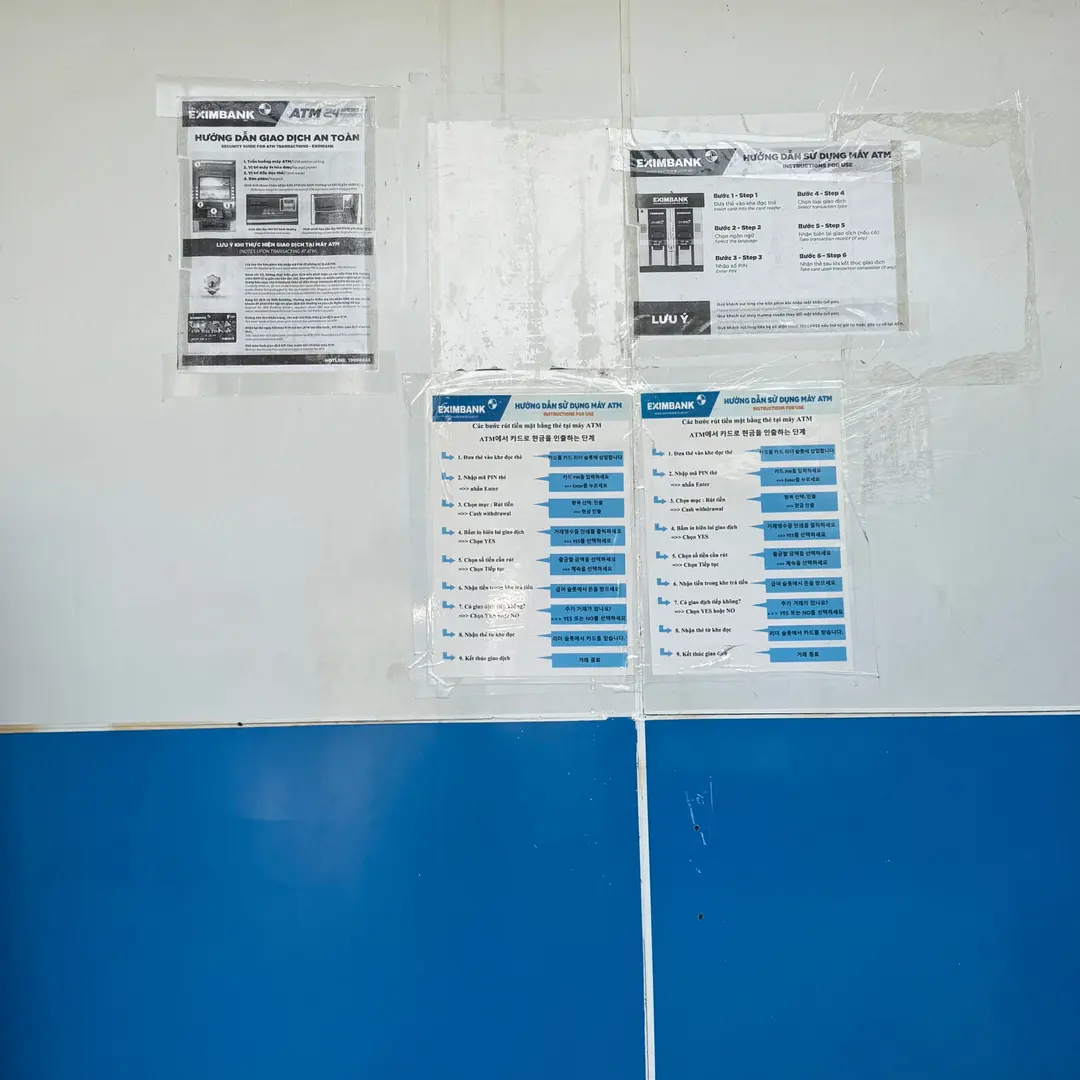 Korean instructions posted on the wall inside the ATM booth