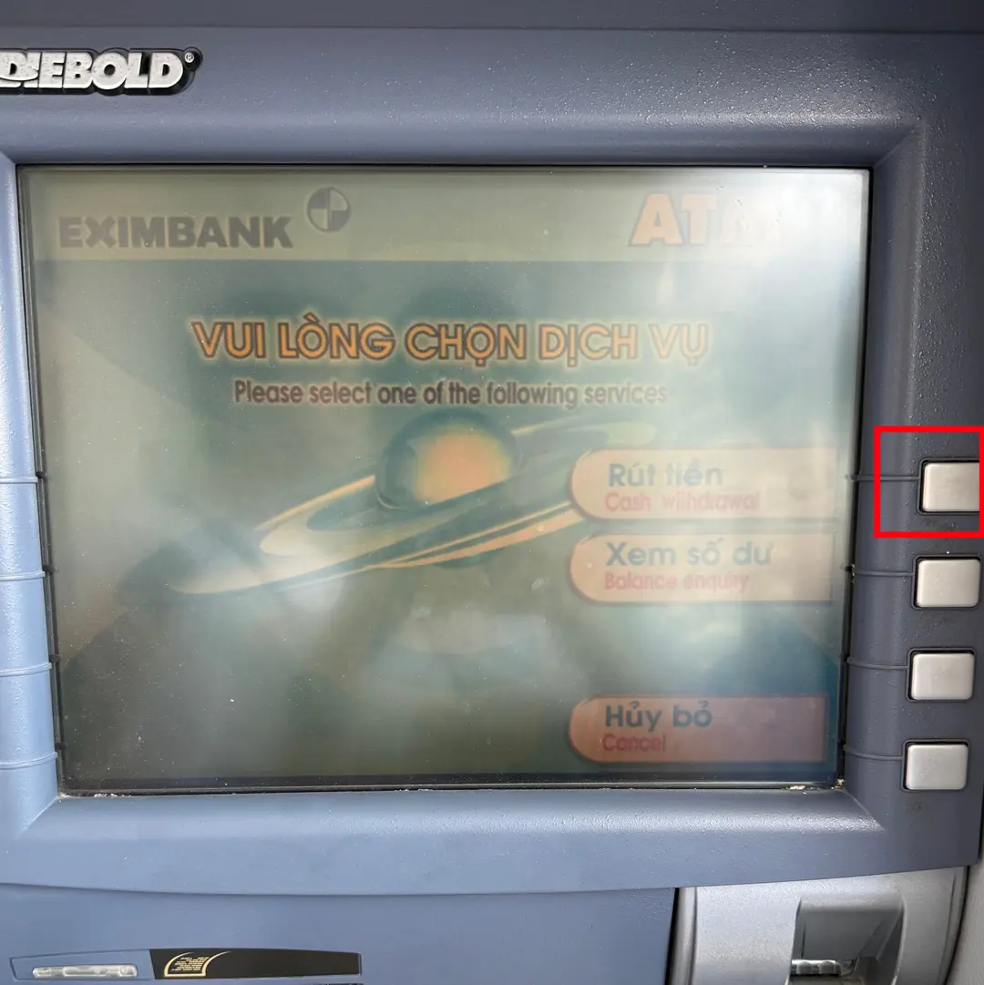 ATM screen showing transaction options, 'Rút tiền' highlighted