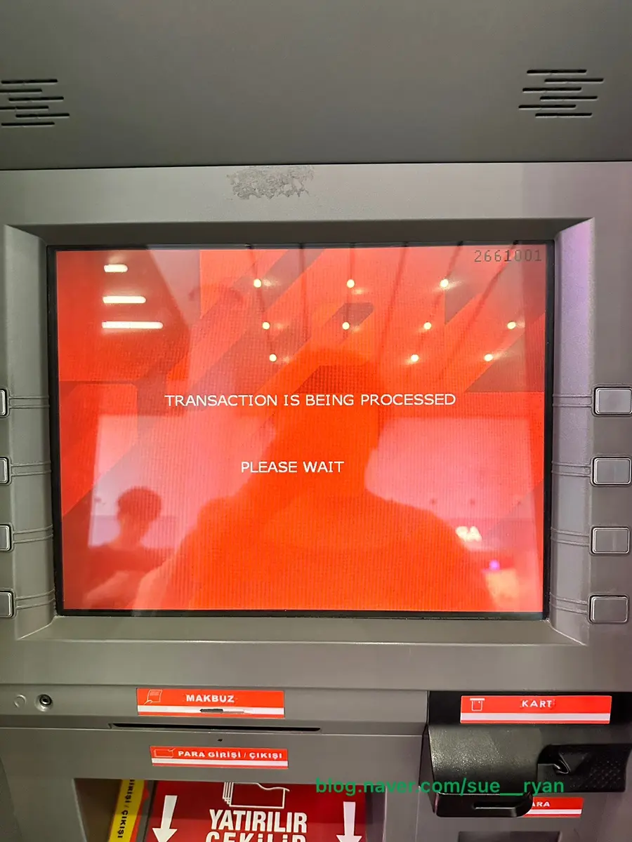 Turkish Lira banknotes being dispensed
