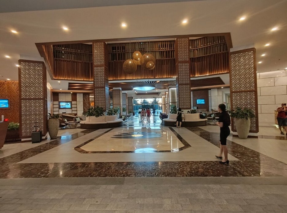 The entrance and lobby area of the hotel, showing a clean and modern design.