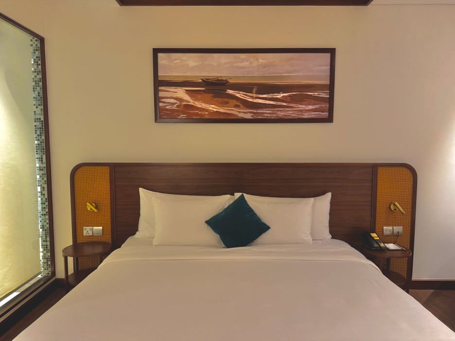 A close-up of the comfortable bed and side table.