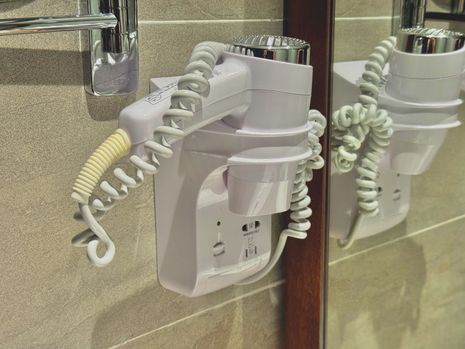 A set of clean, folded towels on a shelf.
