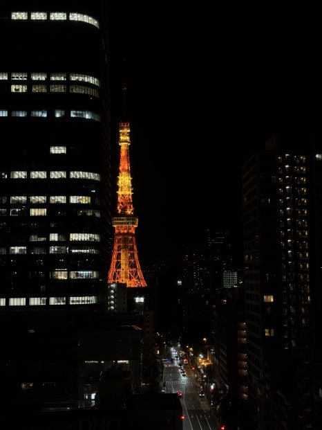 The exterior of APA Hotel Roppongi Ekihigashi at night.
