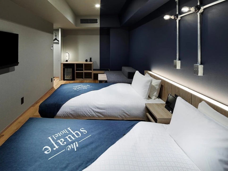 A clean and well-designed guest room at The Square Hotel Ginza.