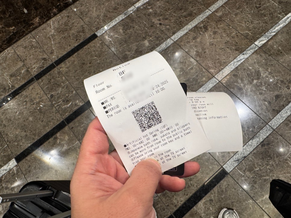 Luggage stored under the bed to save space