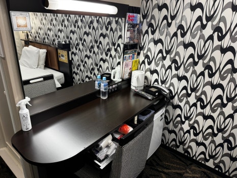 Bed and control panel in the hotel room