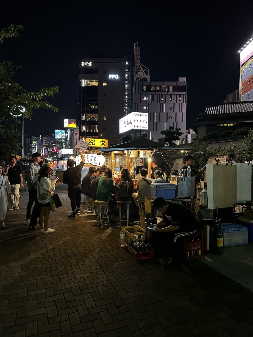 A bustling street scene in Fukuoka, Japan