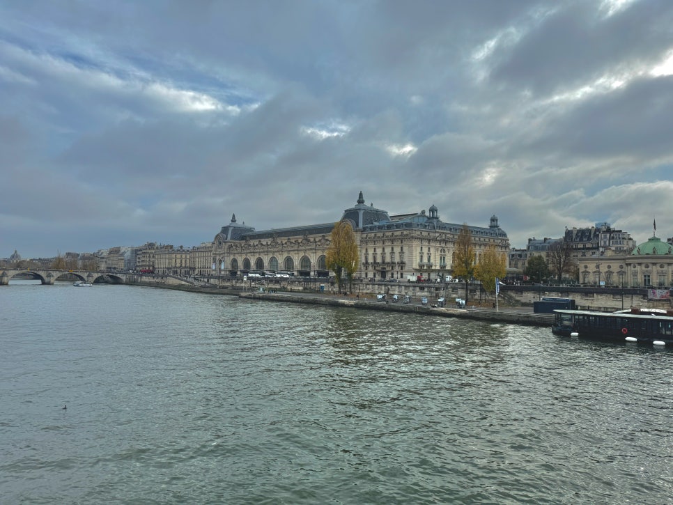 Exterior view of the Musée d'Orsay, a grand Beaux-Arts building on the banks of the Seine.