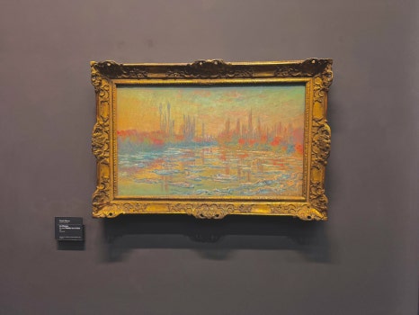 A close-up of a painting by Edgar Degas, likely featuring ballerinas.